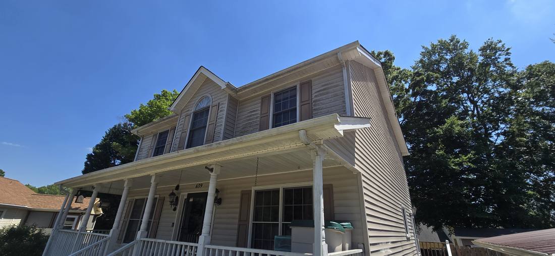 House before house washing showing mildew and algae on siding in Eden NC